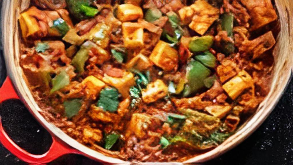 Kadai Paneer · Paneer cooked with onion, bell pepper, tomatoes, and spices.