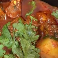 Goat Vindaloo · Goat and potatoes cooked in a tangy hot sauce