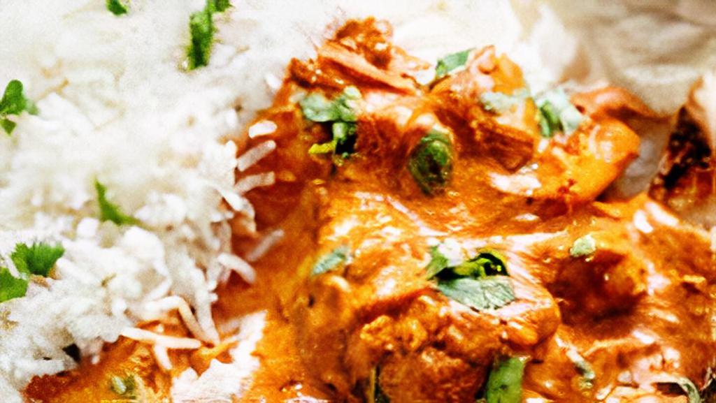 Chicken Tikka Masala · Chunks of chicken in clay oven and then cooked in a light creamy sauce with bell peppers and onions.