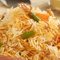 Veg Dum Biryani · Basmati rice cooked with vegetables and fresh herbs, spices and cooked in a curry sauce.