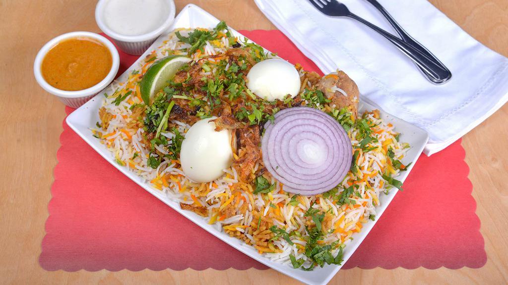 Bonesless Chicken Biryani · Basmati rice cooked with fresh herbs, spices and simmer tender morsels of chicken.