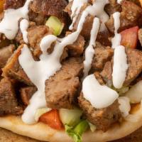 Beef & Lamb Gyro · Pita Bread filled with Roasted Lamb & beef seasoned in our special of Mediterranean spices w...