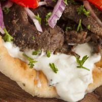 Beef Gyro · Pita Bread filled with Grilled Beef seasoned in our special of Mediterranean spices with let...