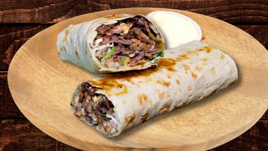 Lamb Burrito · Roasted Lamb and rice seasoned in our special Mediterranean spices with lettuce, tomato, and onion topped by tzatziki sauce and garlic sauce. with optional Homemade hot sauce rolled in tortilla bread