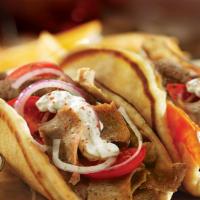 Halal Lamb Gyro · Pita Bread filled with Roasted Lamb seasoned in our special of Mediterranean spices with let...