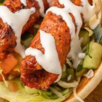 Kufa Gyro · GRILLED KAFTA KABAB PLACED ON LETTUCE BED AND TOPPED WITH TZATZIKI SAUCE, GARLIC SAUCE WITH ...