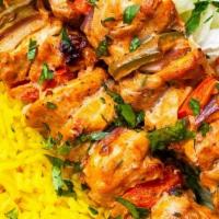 Chicken Kabab Plate · Grilled Chicken Kabab  placed on a bed of basmati rice and our homemade Mediterranean TZATZI...