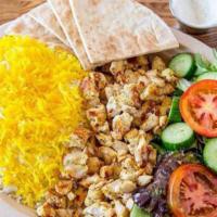 Chicken Shawarma Plate · Grilled seasoned chicken shawarma placed on a bed of basmati rice and our homemade Mediterra...