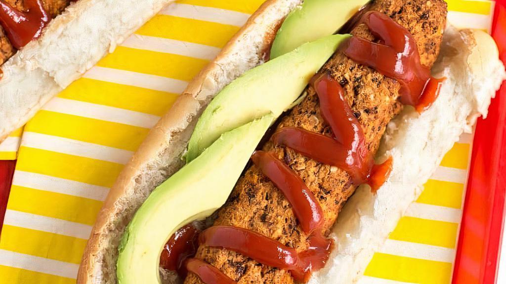 Vegan Hot Dog · Our Signature GRILLED vegan HOT DOG Topped with Ketchup, Mustard. In fresh hot dog bread