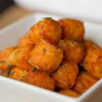 Sweet Potato Tots · Vegetarian. Cinnamon powdered sugar, honey curry aioli.