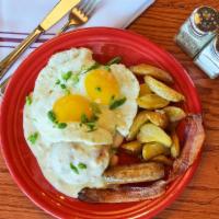 Biscuit & Gravy Deluxe* · Housemade buttermilk biscuit, two eggs, country-style sausage gravy,
choice of breakfast mea...