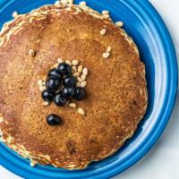 Blue Corn Pancakes · two blue corn pancakes with blueberries & toasted pine nuts 

add bacon or sausage for an ad...
