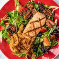 Grilled Salmon Berry* · Grilled salmon filet, mixed greens, blueberries, strawberries, candied pecans, frizzled onio...