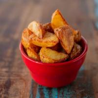 Range Fries · Roasted and fried Yukon Gold potatoes, seasoned to perfection.