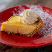 Key Lime Pie · graham cracker crust, authentic Key West lime custard, fresh whipped cream and lime slices