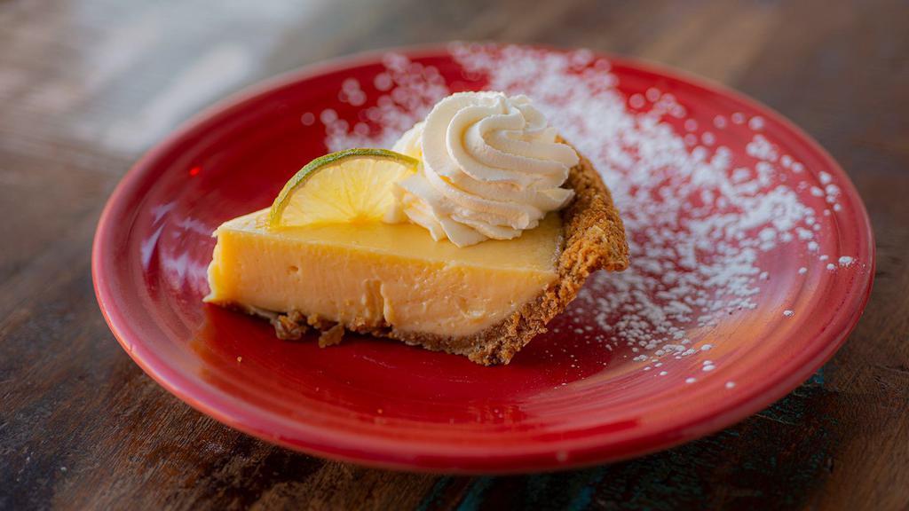Key Lime Pie · graham cracker crust, authentic Key West lime custard, fresh whipped cream and lime slices