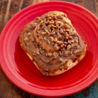 Pecan Roll · Our classic cinnamon roll, smothered with pecans and caramel. Big enough to share, but we wo...