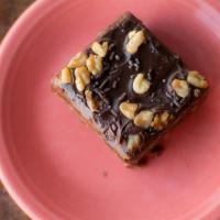 Double Fudge Brownie · A super decadent fudge brownie glazed with another layer of fudge and walnuts.