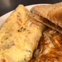 Farmer'S Special Omelet · Ham, bacon, sausage, potatoes, tomatoes, onions and cheddar cheese.