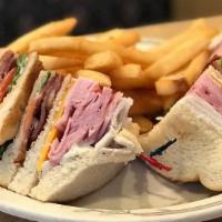 Club Supreme Sandwich · A triple-decker with ham, turkey, bacon, cheddar cheese, lettuce, tomato, and mayonnaise.