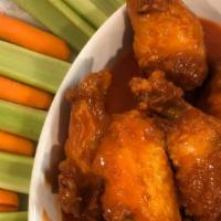 10 Buffalo Wings · Crispy wings tossed in Frank's Red Hot sauce served with your choice of dressing