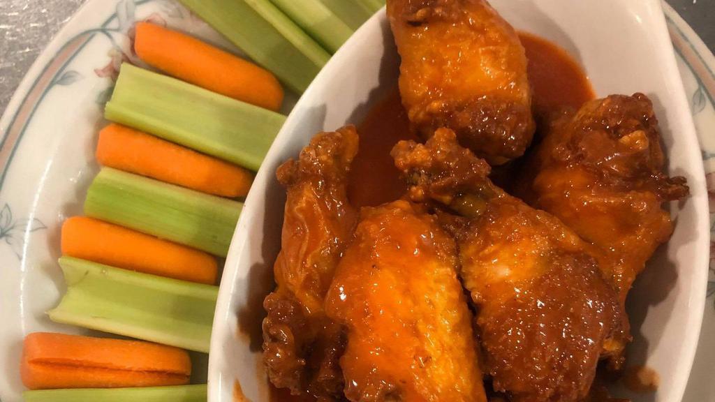 10 Buffalo Wings · Crispy wings tossed in Frank's Red Hot sauce served with your choice of dressing