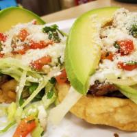 3 Sopes Combo · Hand made corn tortilla topped with your choice of meat, beans, lettuce, onion, cotija chees...