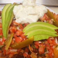 Nachos Nacho Mix · House made tortilla chips covered in your choice of meat &monterey jack cheese, beans pico d...