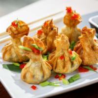 Crab Cheese Wontons · Five pieces of perfectly fried wontons stuffed with fresh crabmeat and cream cheese filling....