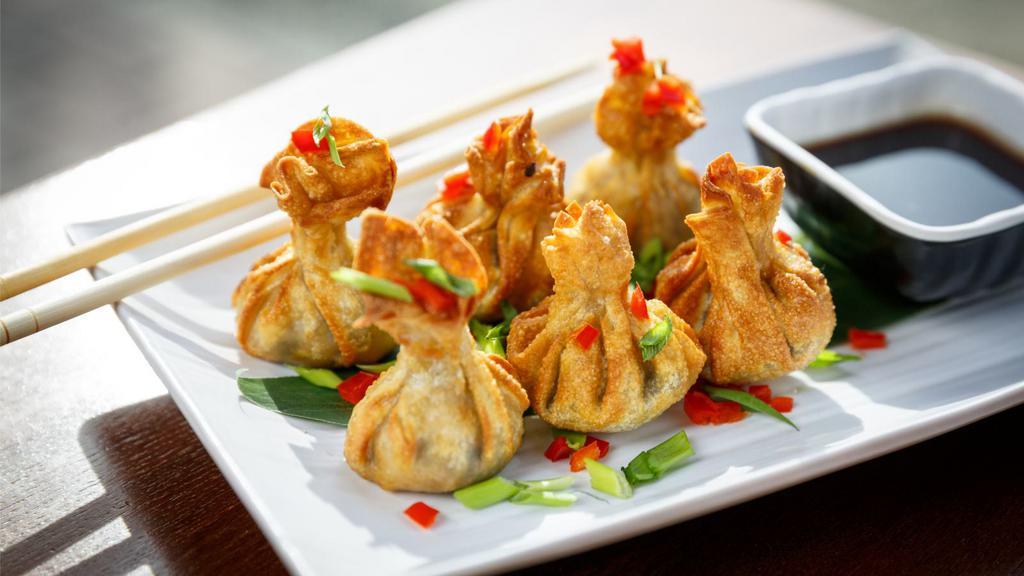 Crab Cheese Wontons · Five pieces of perfectly fried wontons stuffed with fresh crabmeat and cream cheese filling. Served with House-made Sweet and Sour Sauce.