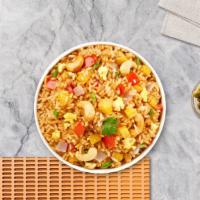 Pineapple Pinnacle Fried Rice · Your choice of protein. Fried rice with pineapple, raisins, onion, roasted cashews, and a to...