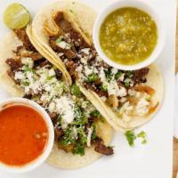 Tacos (Street Tacos) (4) · Corn tortilla tacos served with your choice of any meat, onions, and cilantro, tomatoes, cot...
