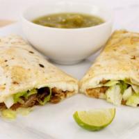 Quesadilla. · Served in a 9 in flour tortilla folded in half slightly crispy on the grill till cheese melt...