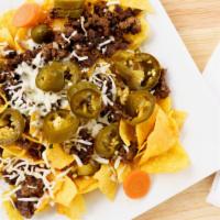 Nachos · Round yellow corn chips,served with beans your choice of any meat,medium nacho cheese sauce,...