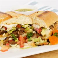 Tortas(French Bread Sandwich) · Served in a grilled toasty french bread with mayo,choice of any meat,lettuce.onions,cillantr...