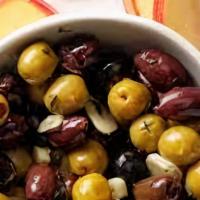 Marinated Olives · Variety of olives marinated in olive oil, lemon & herbs