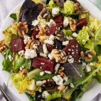 Beet Salad · Marinated beets, walnuts, blue cheese, served on a bed of greens with a housemade balsamic v...