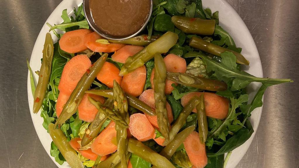 Mixed Green Salad · Spinach, Arugula, Romaine,  pickled carrots, and marinated seasonal veggies with house made balsamic vinaigrette.