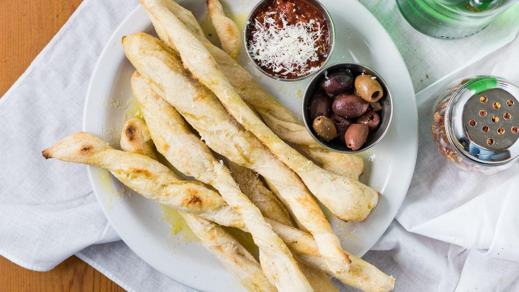 Breadsticks & Olives  · Castelvertrano Olives: Bright green, buttery, and delicious! Served with sour dough breadsticks.
