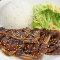 Short Ribs (Kalbi) · Gluten free. Marinated beef short ribs grilled over fire.