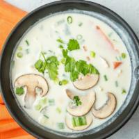 Tom Kha Gai · Coconut milk, chicken, lime leaf, lemon grass, galanga, mushrooms, green onions, and tomatoes.