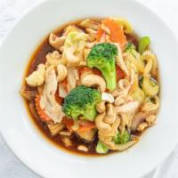 Cashew Chicken · Chicken with pineapple, baby corn, celery, broccoli, onions, cabbage, carrots, and cashews i...