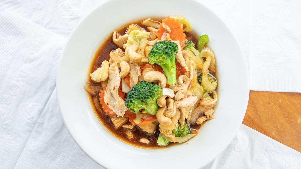 Cashew Chicken · Chicken with pineapple, baby corn, celery, broccoli, onions, cabbage, carrots, and cashews in sweet oyster sauce.