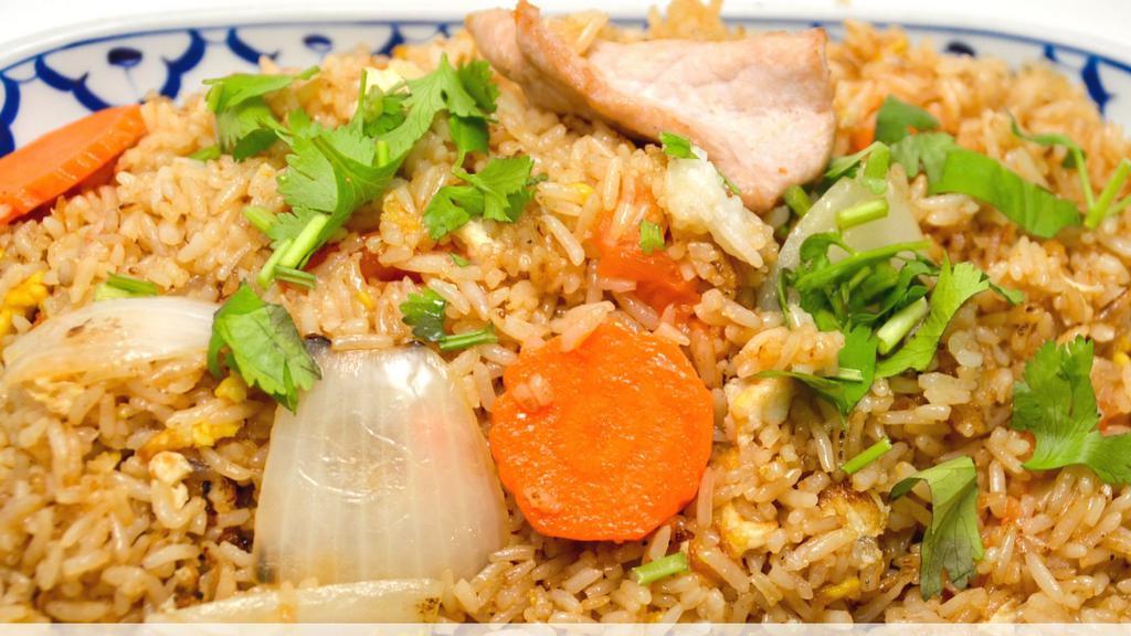 Thai Village Fried Rice · Scrambled eggs, peas, carrots, corn, pineapple,and curry powder in soy sauce.