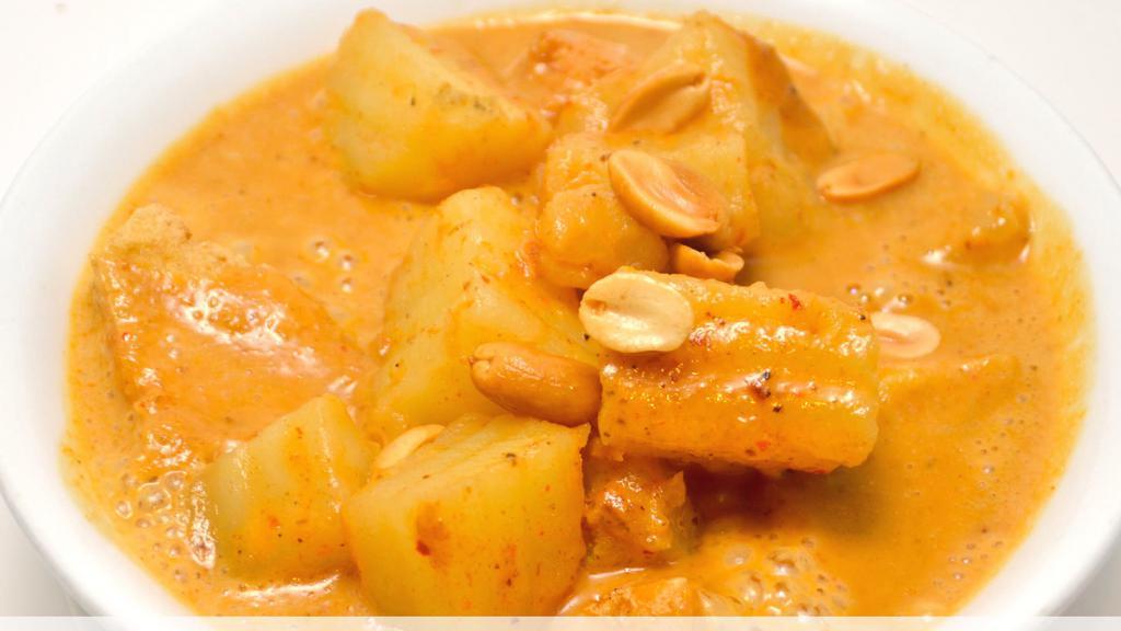 Masaman Curry · Gluten free. Coconut milk, peanut sauce, potatoes, and carrot topped with cashews.