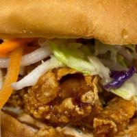 Fried Chicken Sandwich · Battered and fried crispy chicken thighs tossed in a house-made sauce of your choice on a br...
