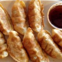Pork Gyoza (8Pcs) · Deep-fried potstickers filled with pork and vegetables served with our homemade sweet gyoza ...