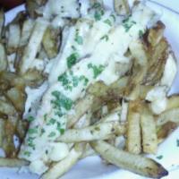 Kasseri Cheese Fries · Fried potatoes topped with cheese and chili.