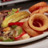 Philly Steak Hoagie · Shaved ribeye steak grilled with bell peppers, onions, and topped with melted mozzarella che...