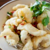 Salt & Pepper Calamari · Deep fried calamari tossed with salt, white pepper, and garlic. Garnished with scallions.